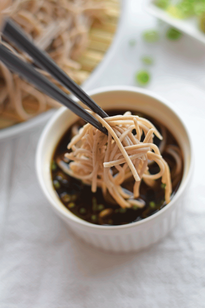 dipping cold soba into mentsuyu dipping sauce