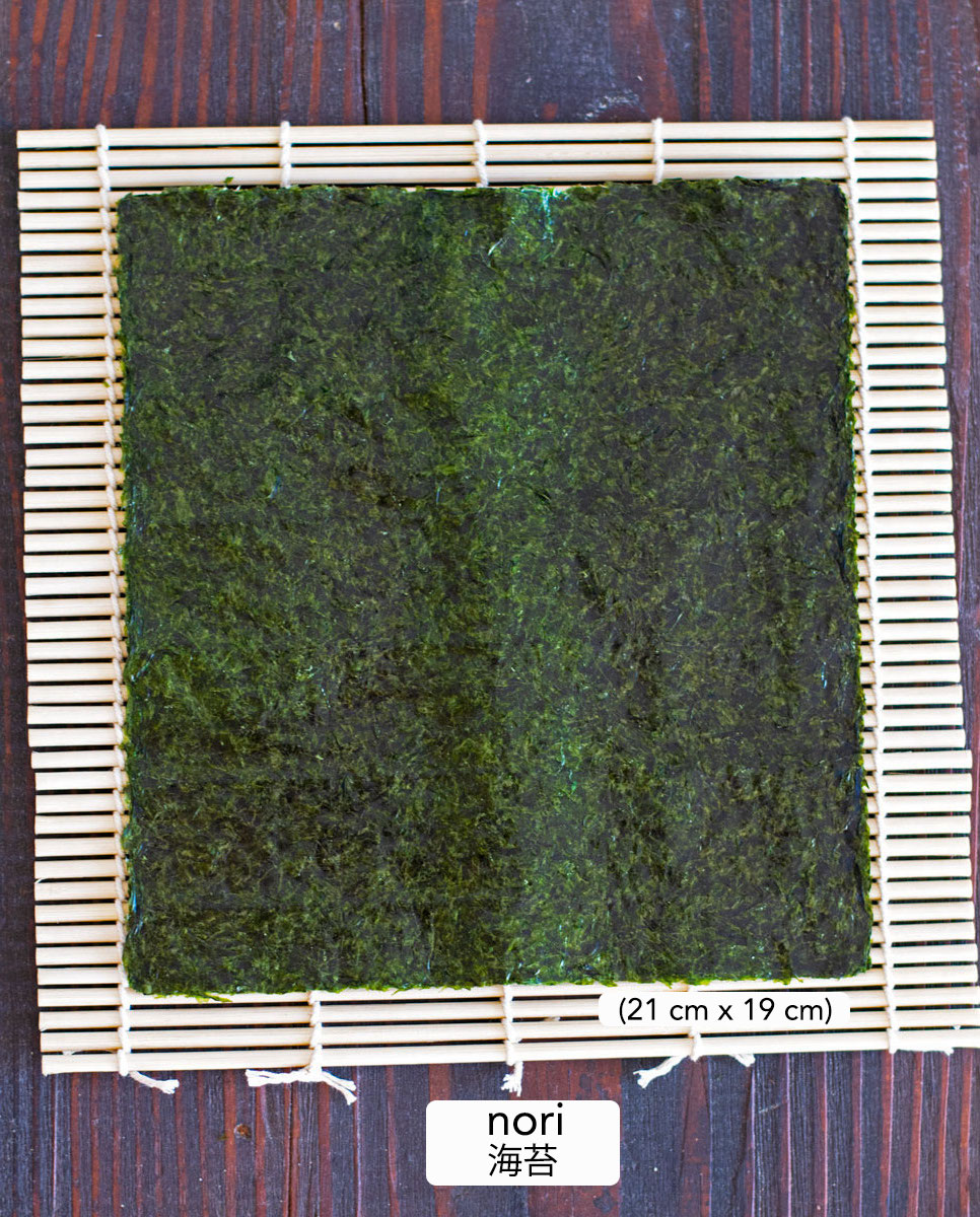 sheet of dried laver on bamboo mat
