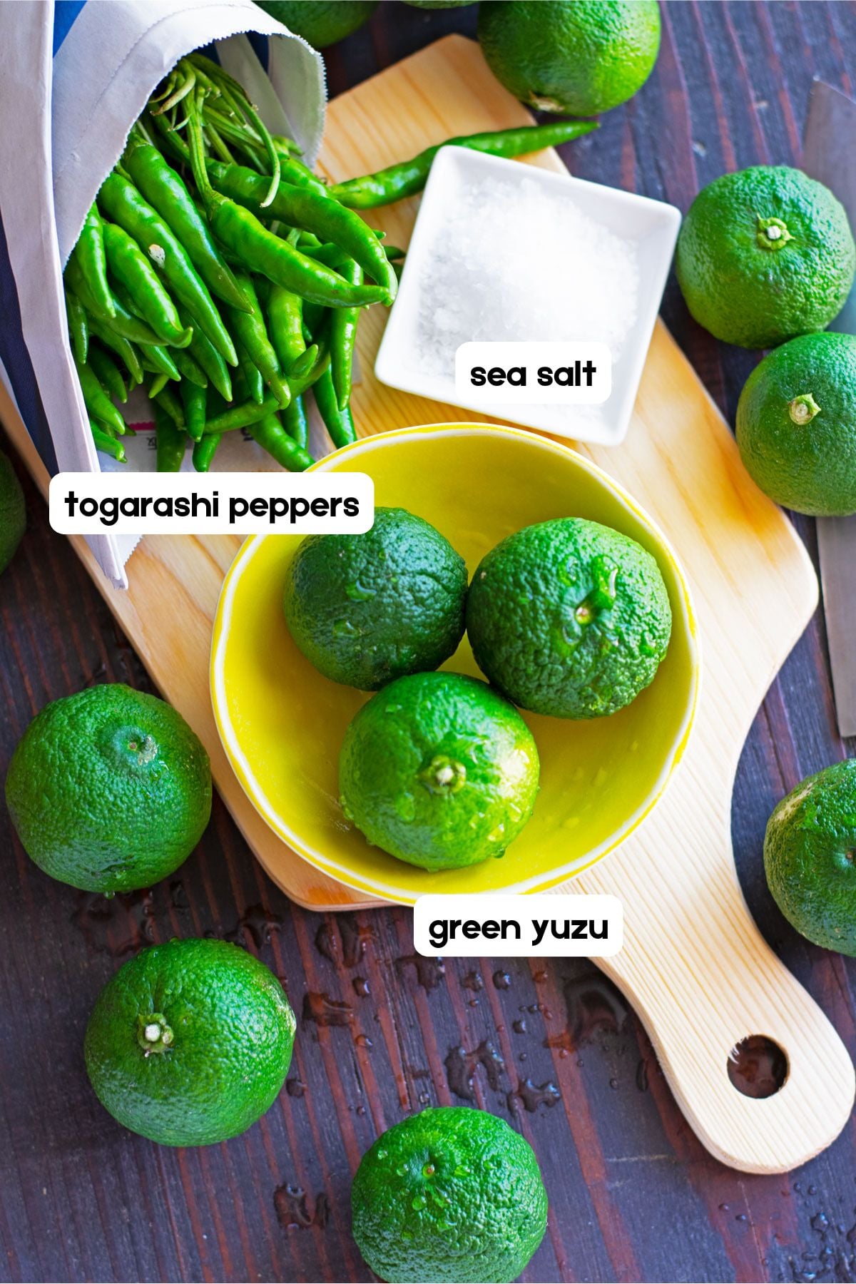 yuzu, togarashi peppers and salt on cutting board