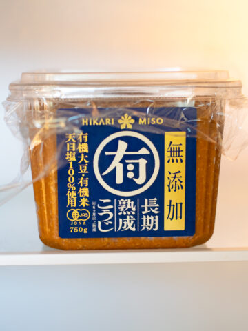 Hikari Miso paste stored in the fridge with plastic wrap and cover