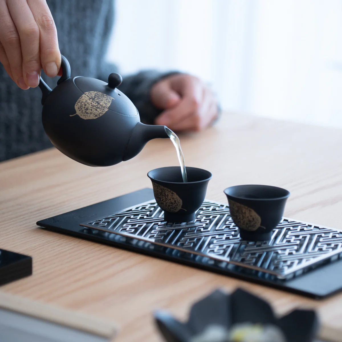 ushirode kyusu, black Japanese teapot with backward-facing handle