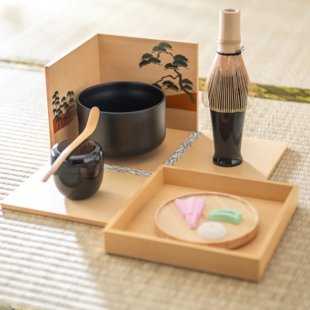 a Japanese tea seat for making matcha. Pictured on a tatami floor with sweets