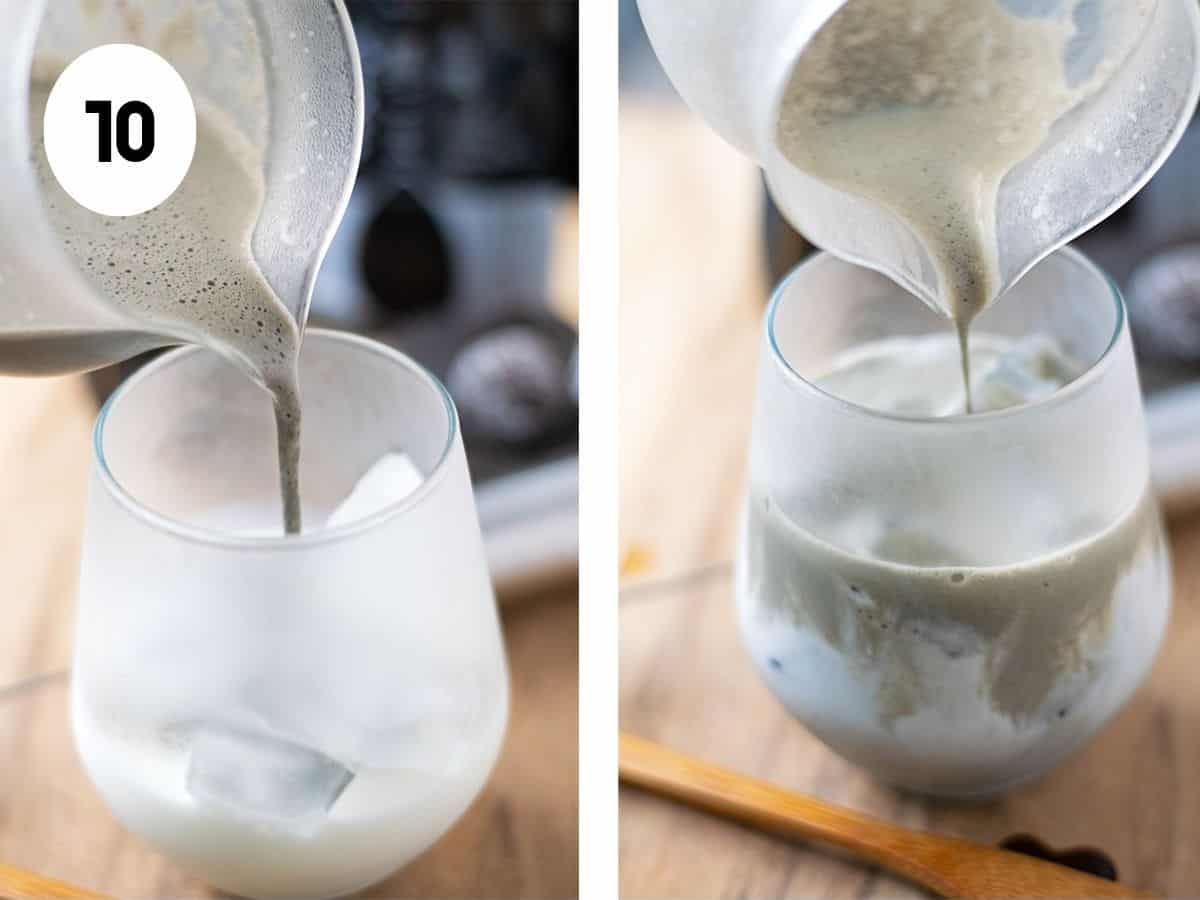 Pouring black sesame latte mixture into a frosted glass partially filled with ice and milk.