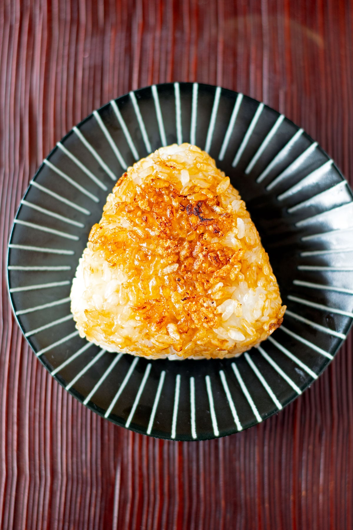 Yakionigiri (grilled rice ball) on a plate.