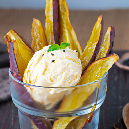 Roasted Japanese sweet potato wedges with scoop of ice cream.
