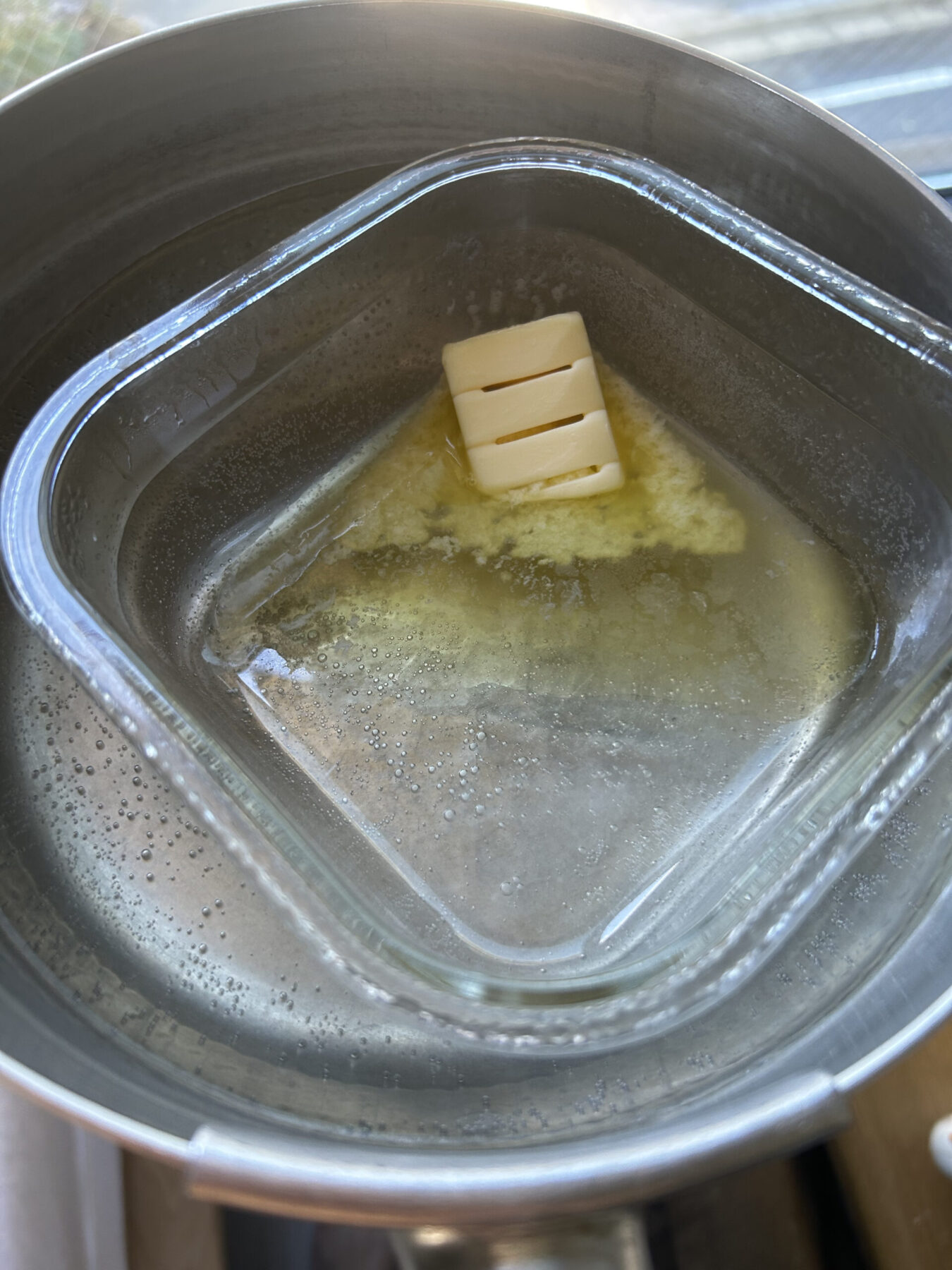 Melting butter in glass pan.