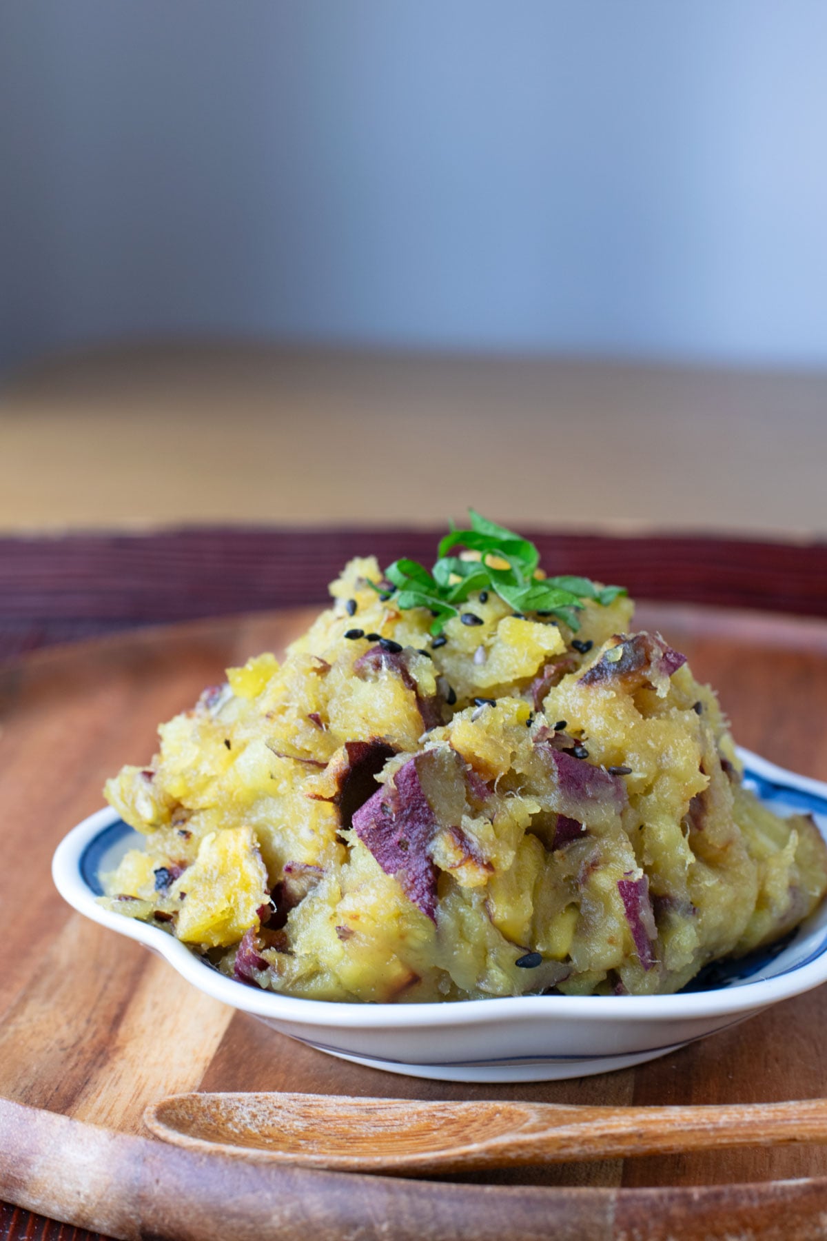 Mashed Satsumaimo Sweet Potatoes garnished with shiso and black sesame seeds.