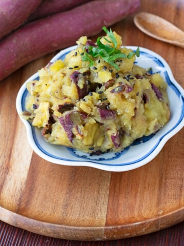 Mashed Japanese sweet potatoes garnished with shiso and black sesame seeds.