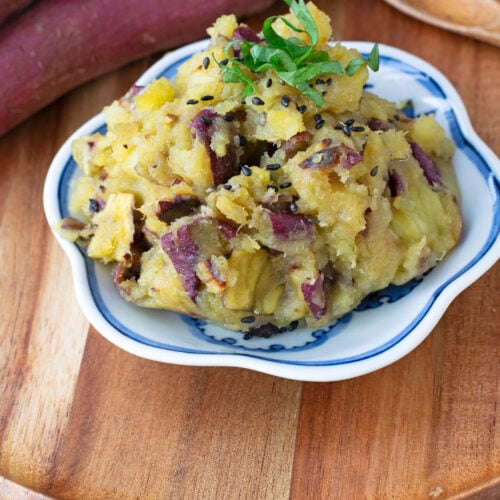 Mashed Japanese sweet potatoes garnished with shiso and black sesame seeds.