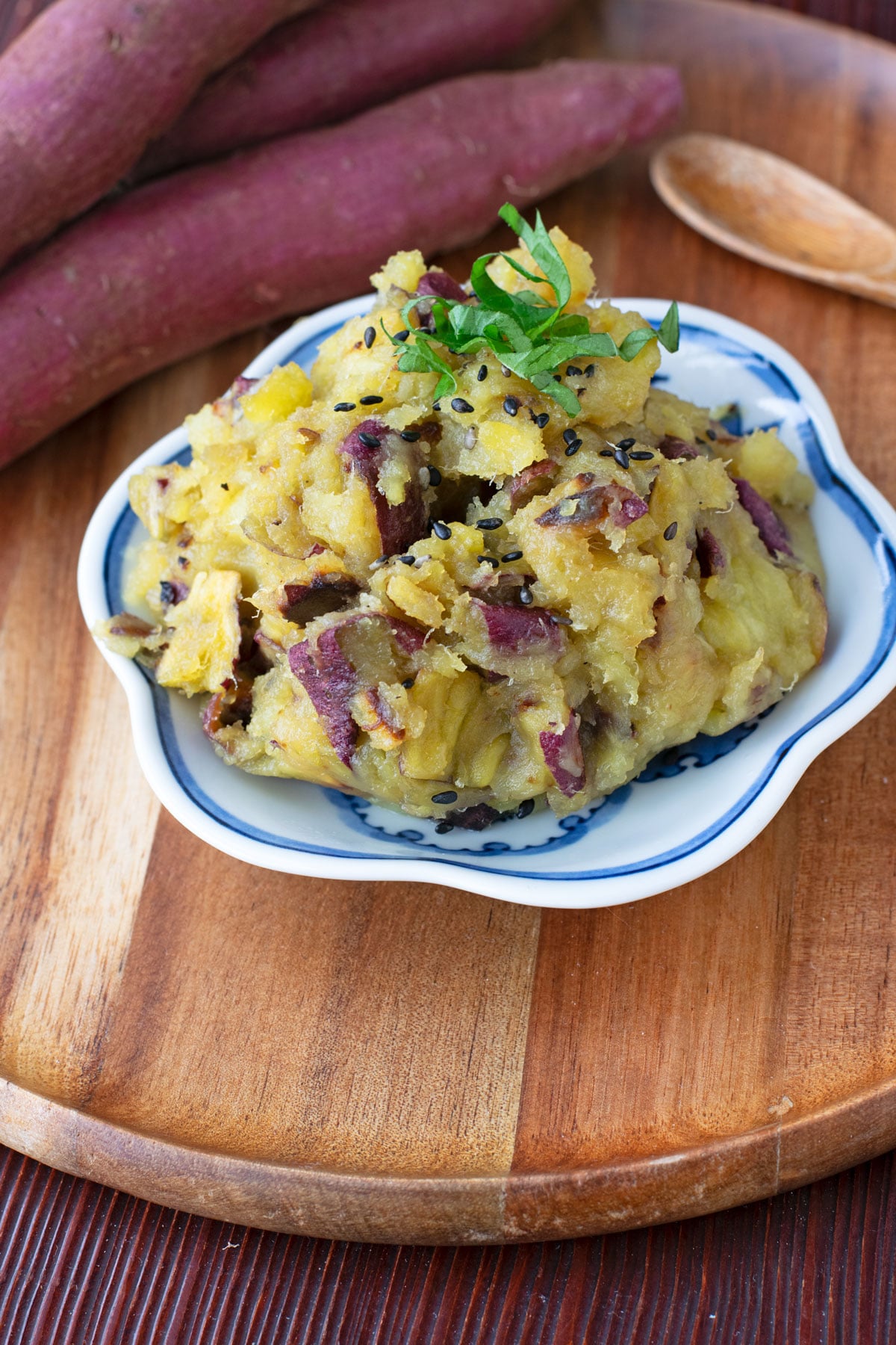 Mashed Japanese sweet potatoes garnished with shiso and black sesame seeds.