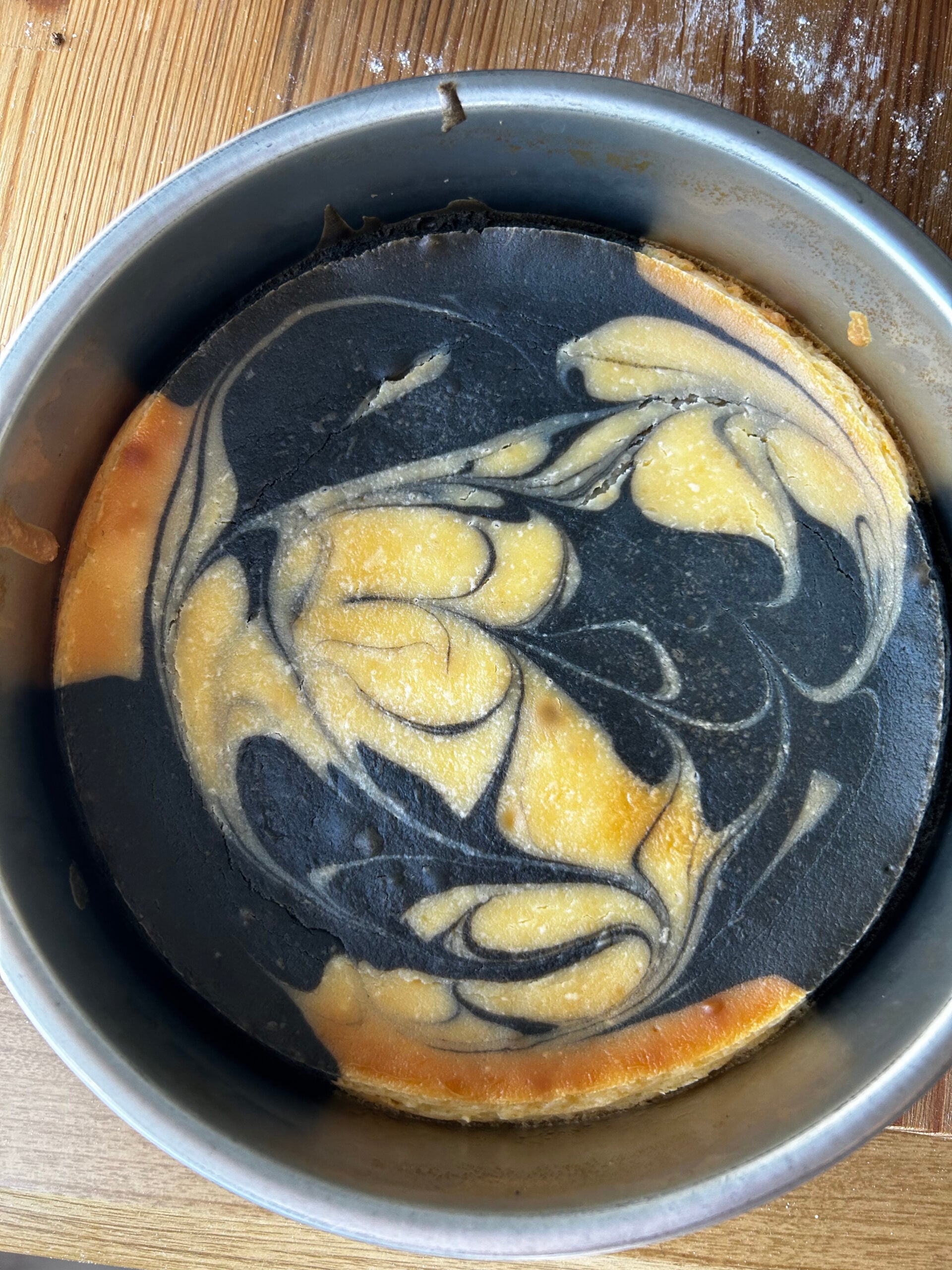 Marbled black sesame cheesecake that was properly covered with aluminum foil.